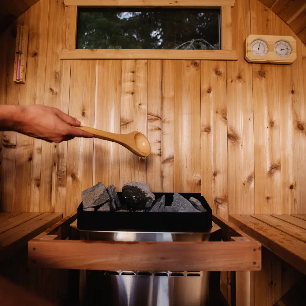 Pouring water on hot stones changes the sauna temperature